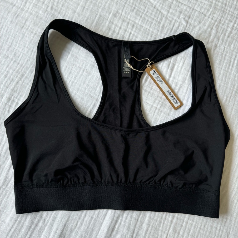 Skims track racer back. Size M.